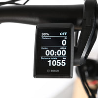Écran de contrôle Bosch sur le guidon d'un vélo électrique Haibike Allmtn 6 chez Loop Sports affichant 1055 km