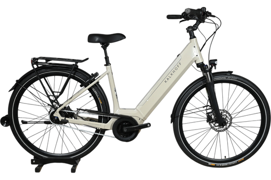 Vélo électrique Kalkhoff Image 3.B Advance beige de Loop Sports avec cadre ouvert et porte-bagages arrière