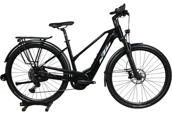 Vélo électrique KTM Macina Premium noir de Loop Sports avec porte-bagages et pneus tout-terrain