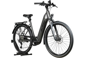 Vélo électrique KTM Macina Style XL gris de Loop Sports avec cadre ouvert, porte-bagages et pneus tout-terrain