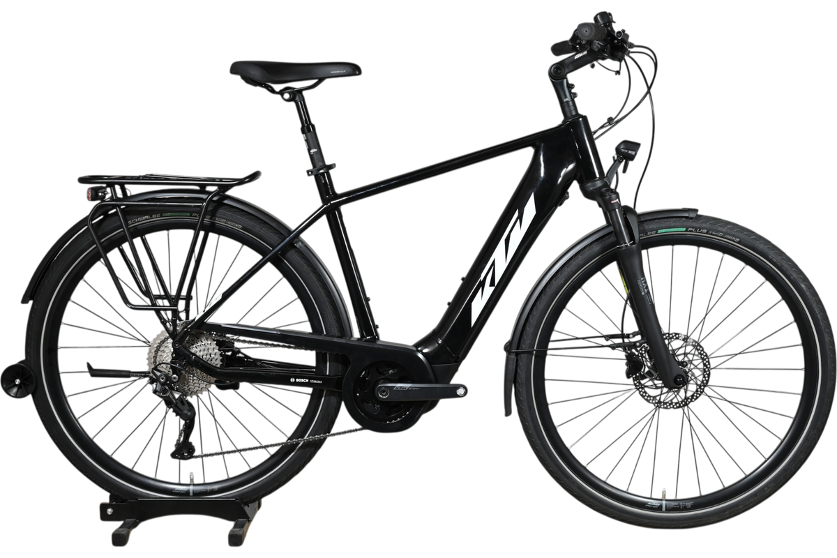 Vélo électrique KTM Macina Tour CX 625 LTD noir de Loop Sports avec porte-bagages et moteur Bosch