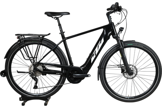 Vélo électrique KTM Macina Tour CX 625 LTD noir de Loop Sports avec porte-bagages et moteur Bosch