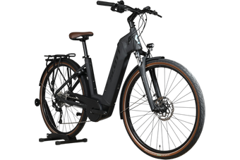 Vélo électrique Loop Sports Scott Sub Active 20 noir avec selle et flancs de pneus marron sur support en bois