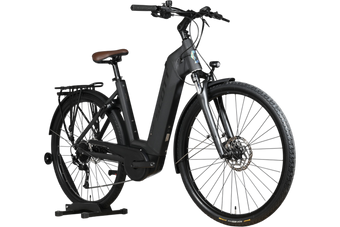 Vélo électrique Scott Sub Active 20 2023 noir avec selle marron, porte-bagages et pneus Continental chez Loop Sports