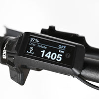 Écran de contrôle Bosch noir sur le guidon d'un vélo électrique Sunn Rage S1 chez Loop Sports affichant 1405 km