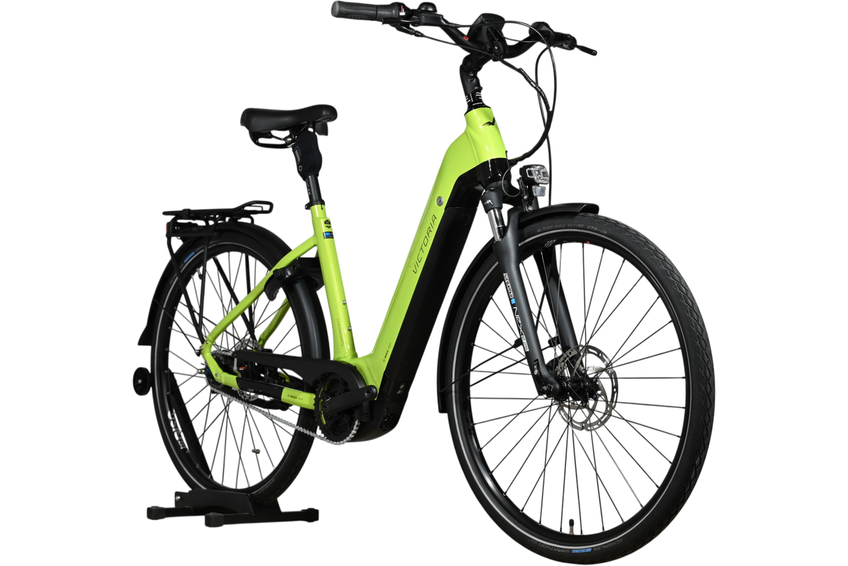 Vélo électrique Loop Sports Victoria eManufaktur 11.7 2023 vert citron avec cadre ouvert et porte-bagages