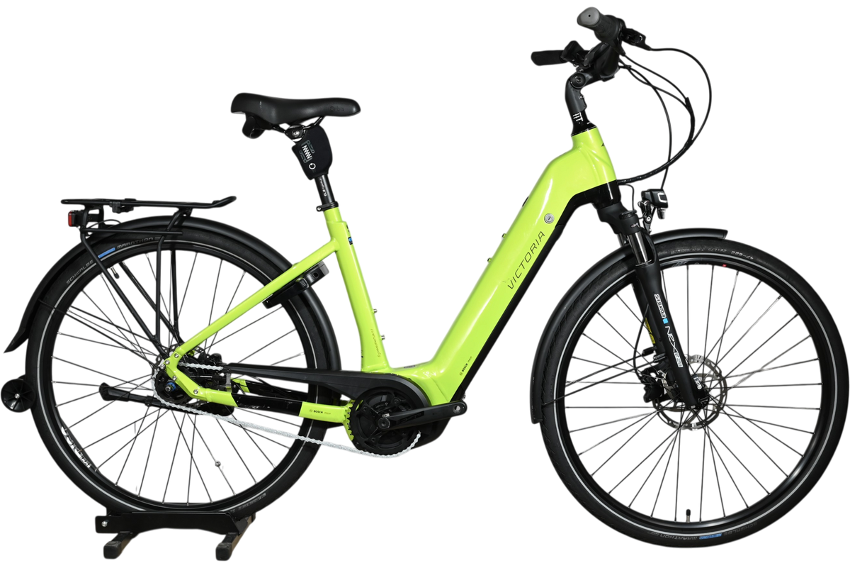 Vélo électrique Victoria eManufaktur 11.7 vert lime de Loop Sports avec cadre ouvert et porte-bagages arrière