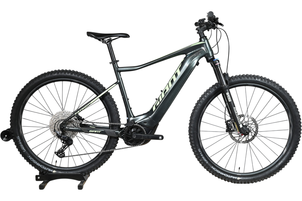 VTT électrique Giant Fathom E+1 2022 gris avec détails vert lime, disponible chez Loop Sports