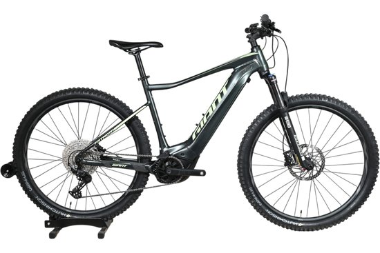 VTT électrique Giant Fathom E+1 2022 gris avec détails vert lime, disponible chez Loop Sports
